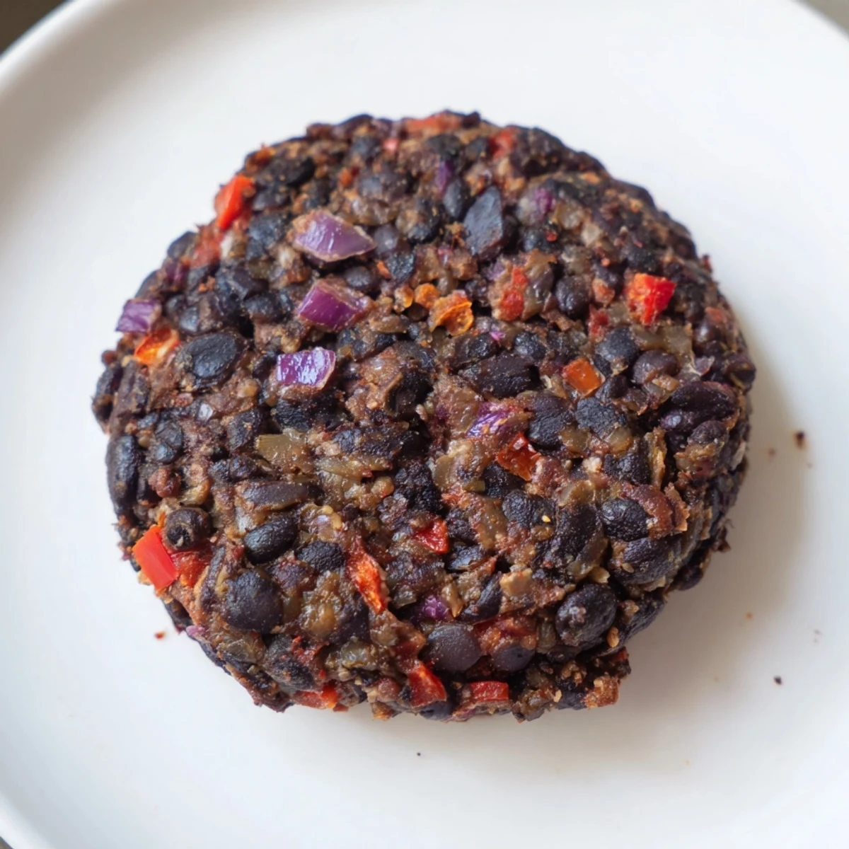 Savory vegetarian black bean burgers ready to be enjoyed, promising a satisfying, hearty meal.