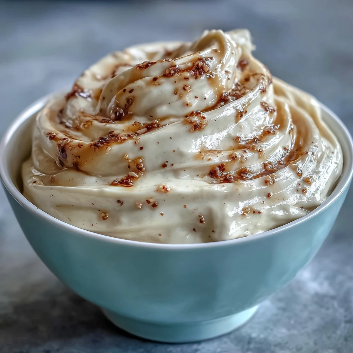 Golden-brown cream puffs filled with rich Hojicha Pastry Cream, dusted with powdered sugar on a rustic wooden board.