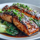 Miso Glazed Salmon with Sesame Bok Choy, glistening and caramelized, served with vibrant green bok choy.