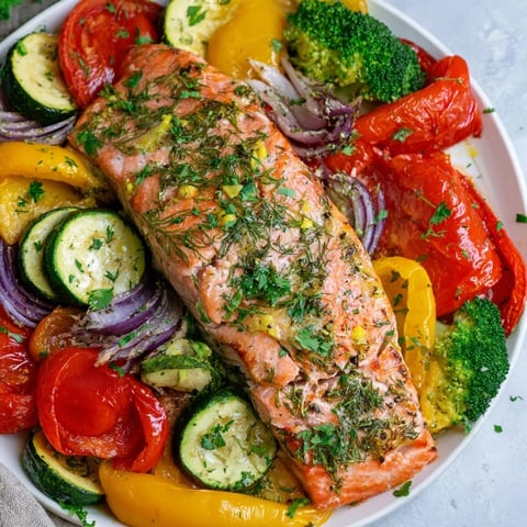 Golden, flaky salmon sheet pan bake with colorful roasted vegetables, ready to serve and enjoy.