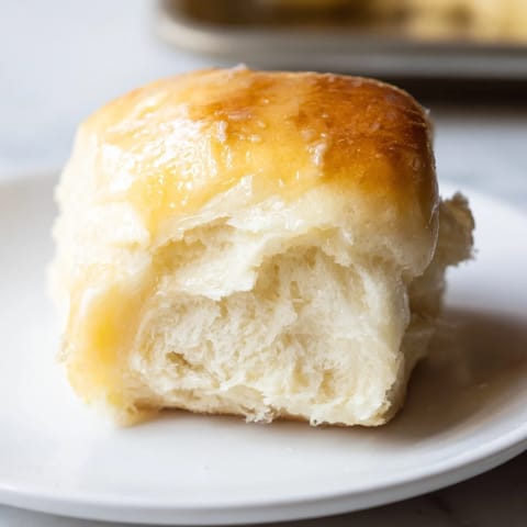 Fluffy and warm, these Quick-Rise Dinner Rolls promise a soft, tender interior and perfect crust.