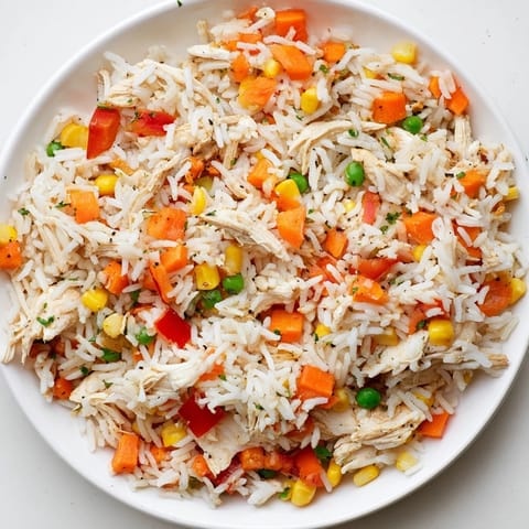 The savory one-pot chicken and rice recipe showcases tender chicken and fluffy rice in a hearty Latin dish.