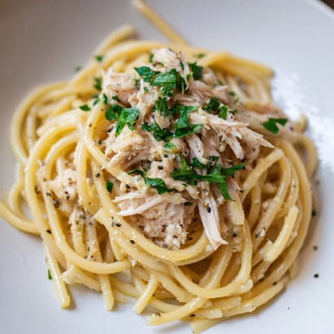 Golden-hued Simple Garlic Butter Bucatini, a savory pasta dish ready to be enjoyed.