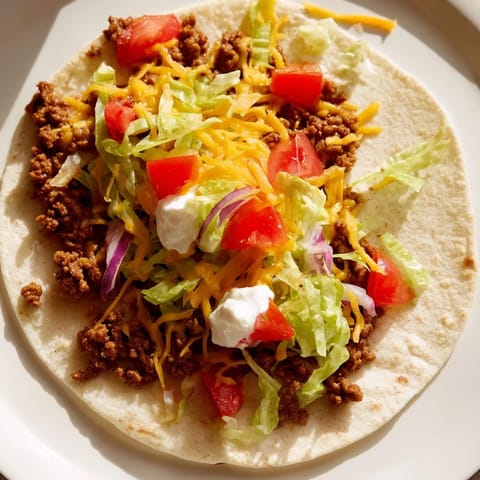 Sizzling Crispy Smash Tacos are crispy and tempting, loaded with seasoned beef and fresh garnish.
