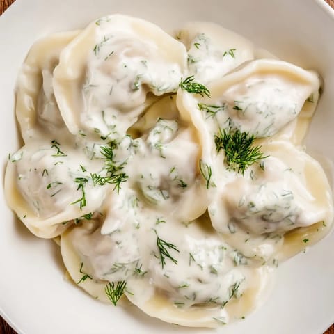 These perfectly formed Russian Pelmeni sit in a steaming bowl, a hearty and delicious meal.