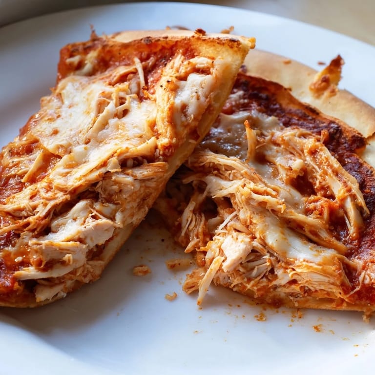 Savory Leftover Pizza Grilled Cheese, a comforting mix of pizza and grilled cheese, ready for dipping.