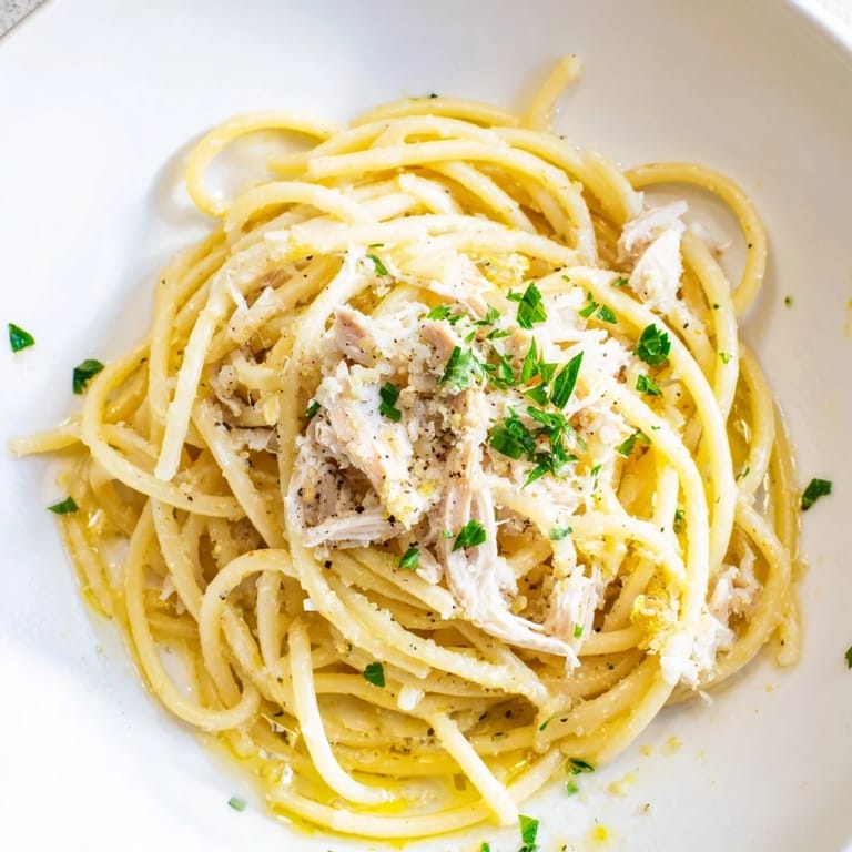 Close-up of Simple Garlic Butter Bucatini: pasta glistening in flavorful garlic butter.
