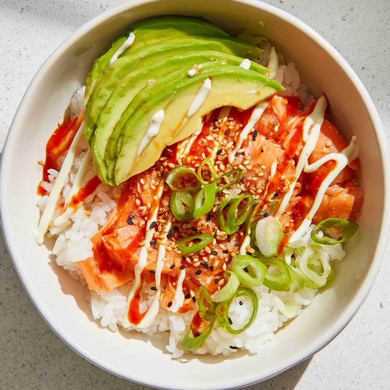 Warm and comforting: A quick Classic Salmon Rice recipe with flaky fish, sesame and fresh onion.