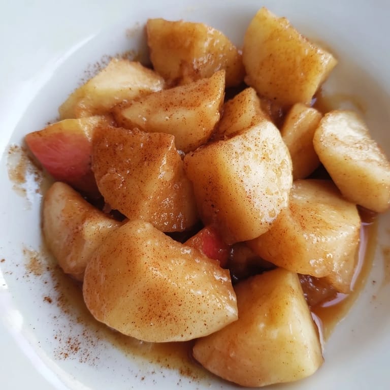 Enjoy a spoonful of tender slow cooker stewed apples, a delightful dessert or side dish.