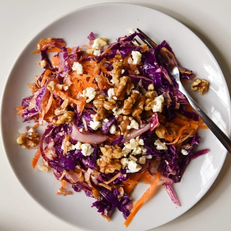 A steaming skillet of sautéed cabbage is mixed with colorful bell peppers and parsley for a bright, hearty salad.
